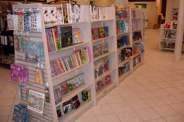 another one of our book shelves filled with trade paperbacks